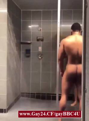 Black gay guy jerking off in the gym shower with a stranger - boyfriendtv.com